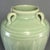 Fine antique Chinese celadon four‑handle vase. Beautiful carved lotus‑petal relief decoration on the body, smooth soft...