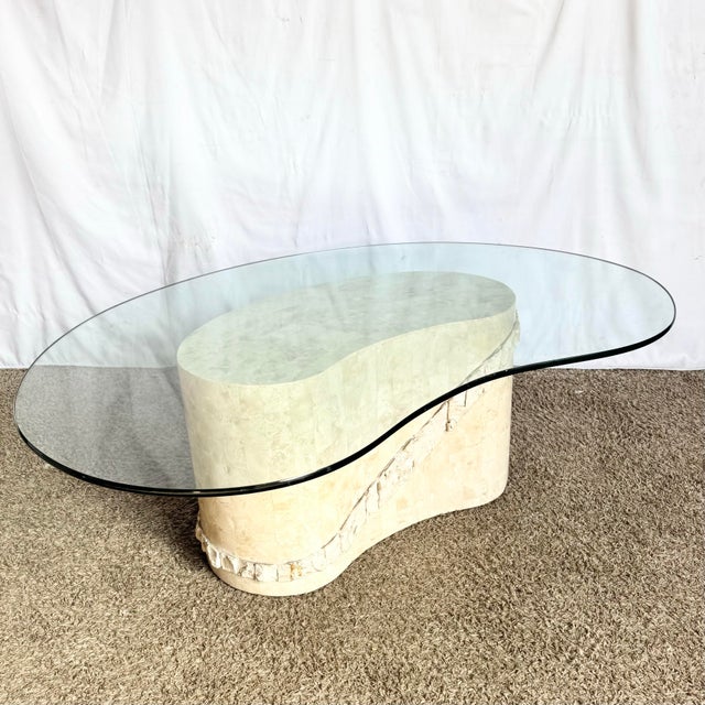 This striking postmodern coffee table blends sculptural artistry with organic elegance. Its biomorphic kidney-shaped stone...