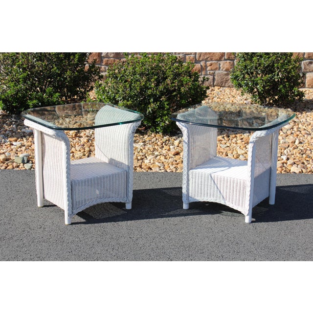 Lloyd Loom wicker furniture is suitable for outdoor use, the frame being crafted from aluminum. This is a matching pair of...