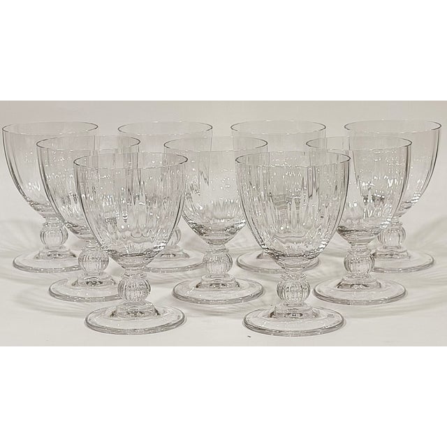 These are nine vintage crystal wine glasses that have subtle fluted bowls. They measure 4.75" tall and 3.25" in diameter...