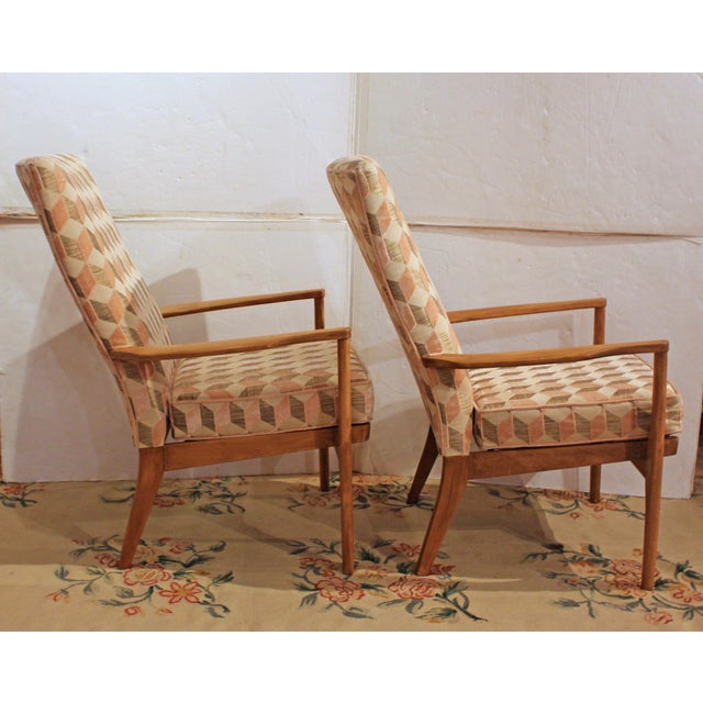 Mid-20th century Pair of Parker-Knoll Arm Chairs, English. Period upholstery. Maker's name on fabric covering for the seat...