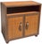 Vintage campaign-style console cabinet featuring woven rattan panels across the top, sides, and cabinet doors. The warm...