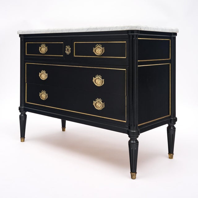 French chest of drawers or commode in the Louis XVI style. This chest is made of solid wood construction, primarily...