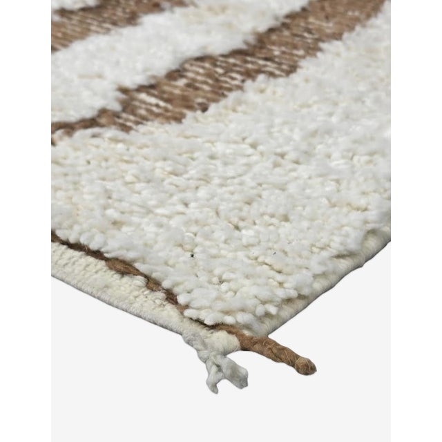 Modern Ivory & Brown Moroccan Rug – Handmade Abstract Berber Wool Carpet This elegant handmade Moroccan rug features a...