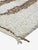Modern Ivory & Brown Moroccan Rug – Handmade Abstract Berber Wool Carpet This elegant handmade Moroccan rug features a...