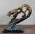 Sculptural bronze tiger in a dynamic leaping pose, executed in an Art Deco style with strong musculature, openwork body,...