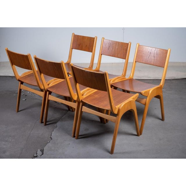 Set of six stacking chairs produced by Sorø Møbelfabrik in the 1950s. Each chair features a solid beech frame with seat...