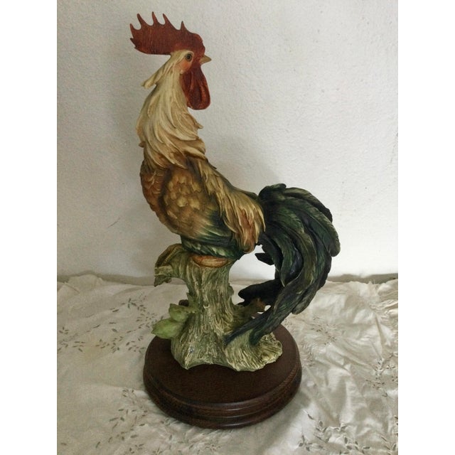 Beautiful decorative rooster figurine, hand-painted with vibrant natural tones. The piece features detailed craftsmanship...