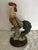 Beautiful decorative rooster figurine, hand-painted with vibrant natural tones. The piece features detailed craftsmanship...
