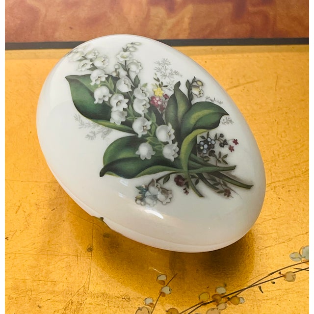 Vintage Limoges France Handpainted porcelain box egg shaped. with Lilly of the valley.
