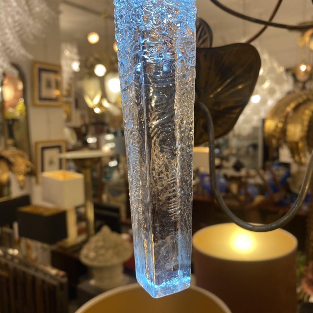 Pair of Swedish pendant lamps from the 1980s. Thanks to their Orrefors glass, they perfectly resemble two icicles. A...