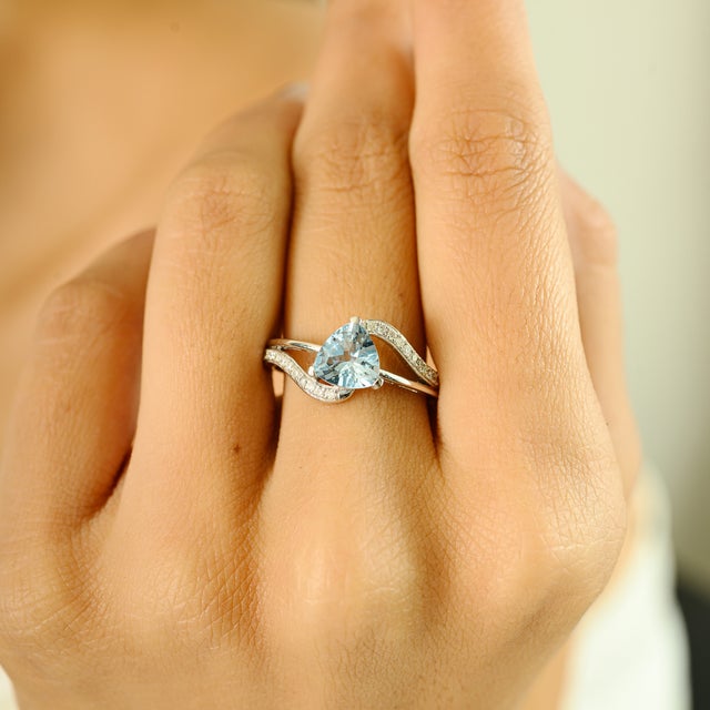 Capturing the serene beauty of ocean hues, this exquisite ring is crafted in luxurious 18K white gold and features a...