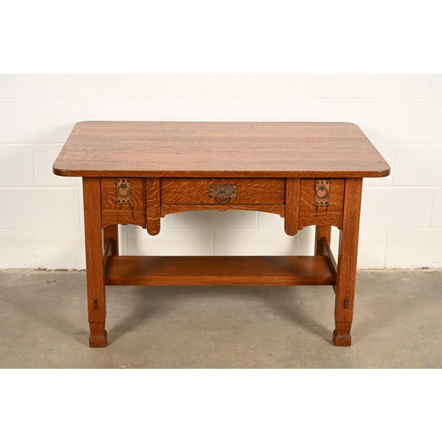 A gorgeous antique Mission or Arts & Crafts period writing desk or library table In the manner of Stickley Brothers USA,...