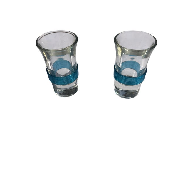 Vintage Mid-Century Carousel Liquor Dispenser with Set of 6 Shot Glasses sitting on a circular chrome plate with 6 cut-out...