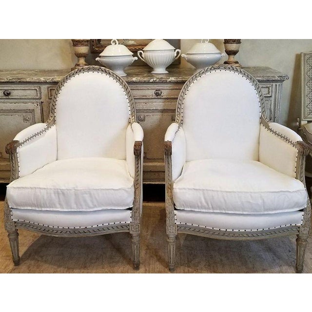 A room is often defined by its most inviting seat, and these exceptional 19th-century Louis XVI bergères possess that rare...