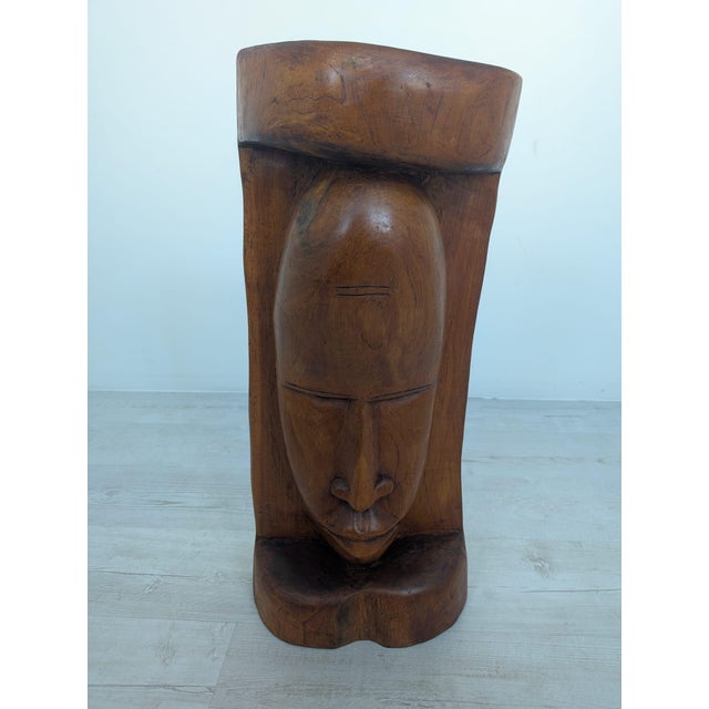 African-style wooden sculpture made of solid exotic wood This African-style sculpture is crafted from solid exotic wood....