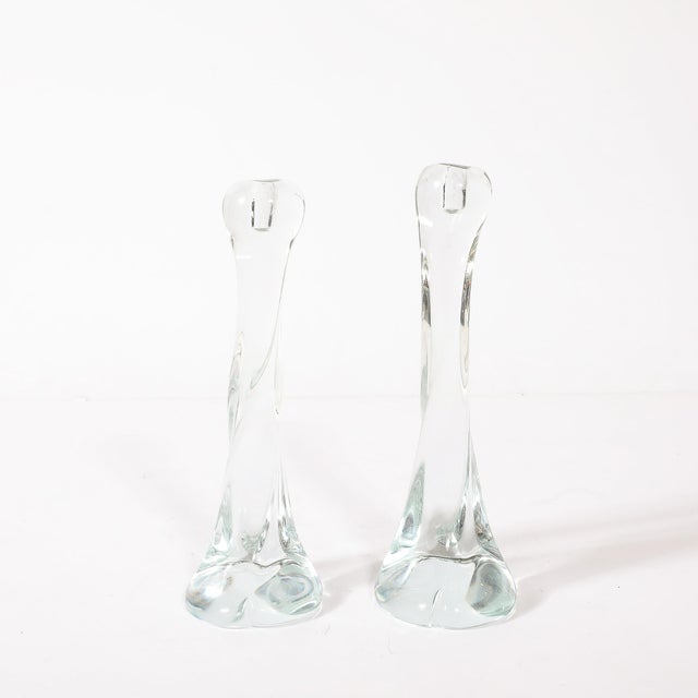 This pair of signed Renato Anatra Murano glass candlestick holders, created in Italy circa 1975, seamlessly blends refined...