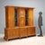 Art Deco living room cabinet in maple burl veneer. The cabinet features five doors, three of which are paneled and...
