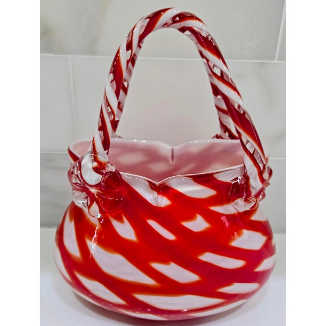 This striking vintage blown art glass handbag vase brings a pop of candy-apple red and creamy white to any shelf or...