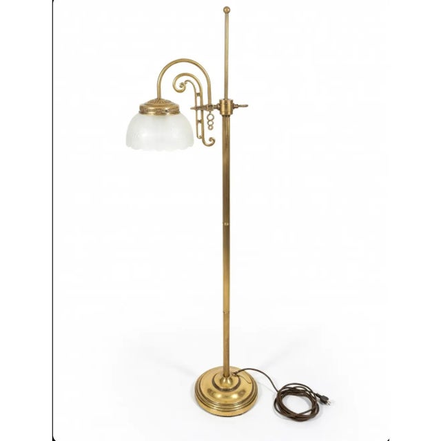 Illuminate your space with the timeless allure of this vintage Art Deco floor lamp, a perfect accent for mid-century...