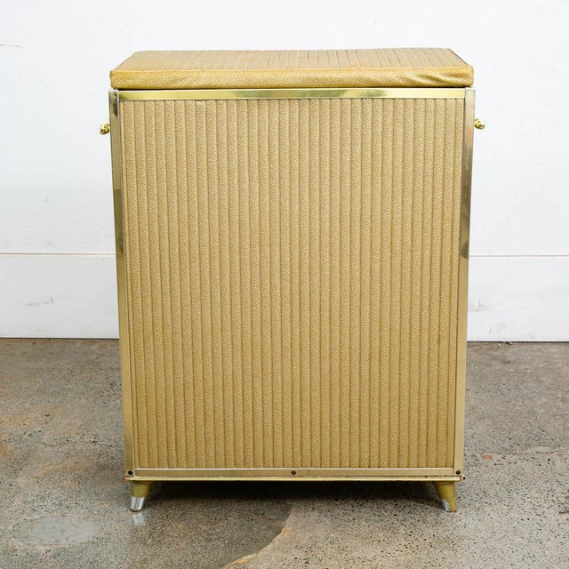 Unique gold lift top laundry basket / caddy. Great for any compact space. C 1960-1970s. Unique and well designed.