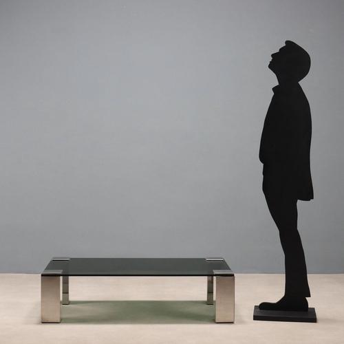 Vintage coffee table with rectangular smoked glass top and chromed metal legs. This piece is attributed to the mentioned...