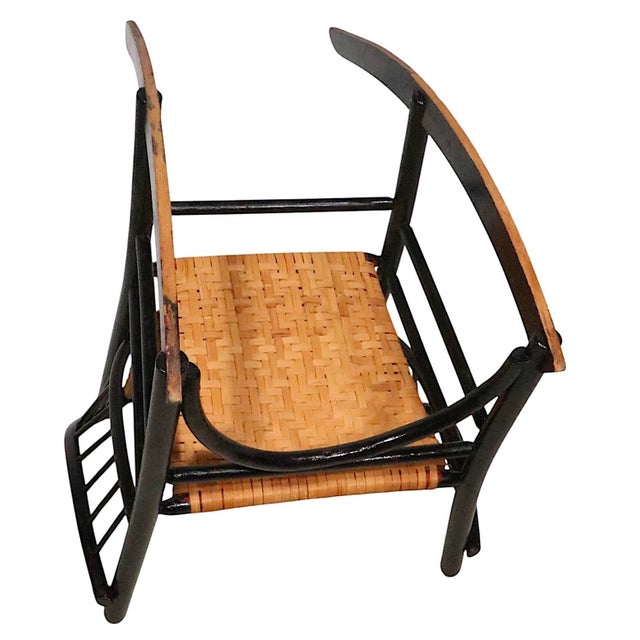 Vintage Old Hickory style barrel form rocking chair, having a dowel wood frame with a newly replaced woven cane seat and...