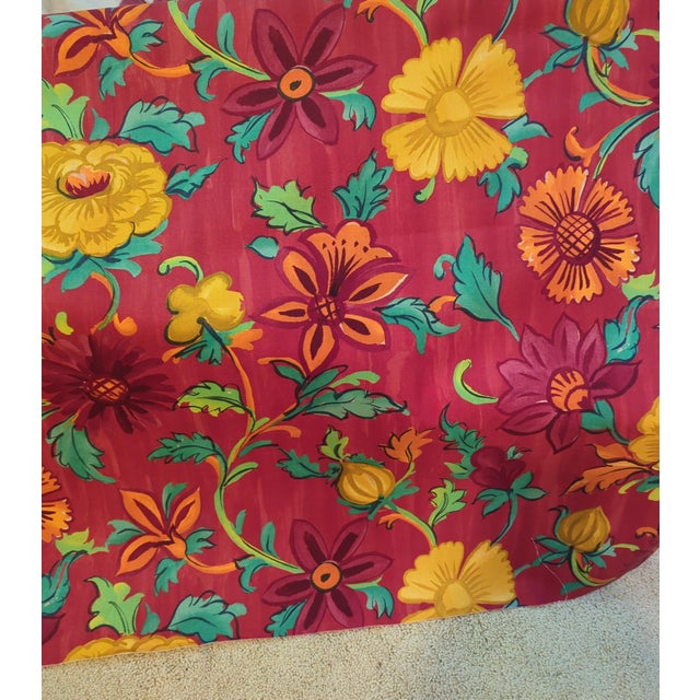 Genuine Designers Guild "Kasuti" printed cotton — a bold, richly saturated floral on a deep red ground, with marigolds,...