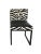Derision dining chair with black steel bases. Upholstery is done in black and white zebra fabric and black faux-ostrich...