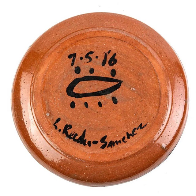 (YOU CAN MAKE REASONABLE OFFERS.) The charger plate is 16" in diameter and is signed in the back. The center of the plate...