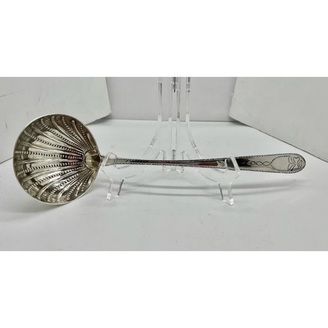 This is the description from the appraiser.."An exceedingly graceful ladle indebted to the artistic inspiration of the...