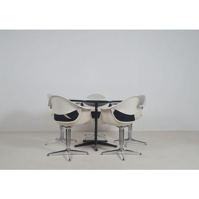 Exceptional and quite rare set of dining table and 5 chairs manufactured by herman miller . the seats (daf model) were...