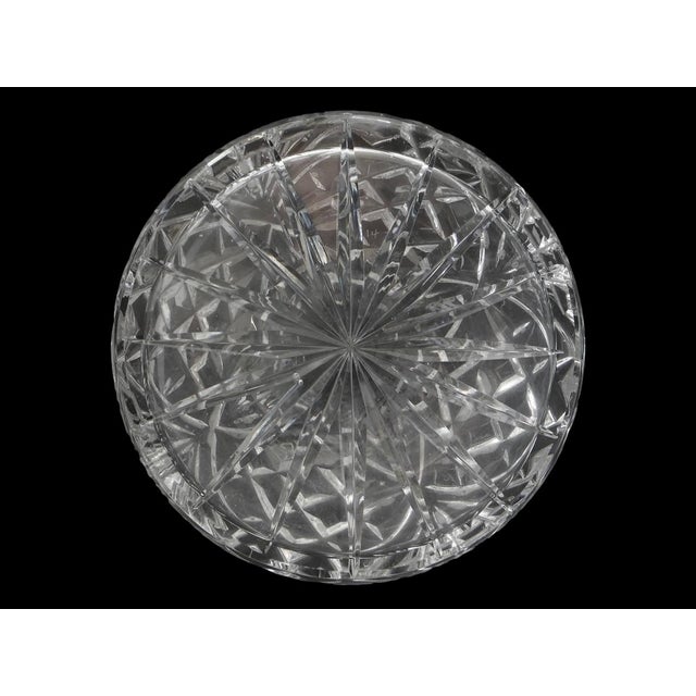 An elegant antique English cut crystal decanter with a beautifully proportioned silhouette, richly hand-cut body, and...