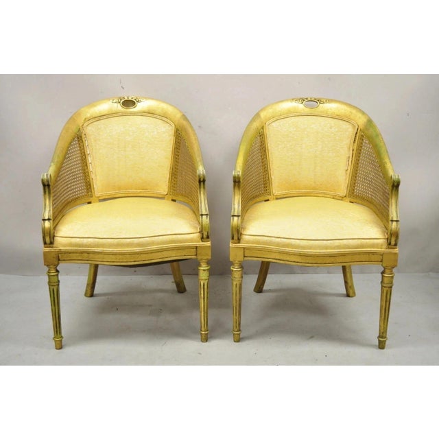 Vintage Italian Hollywood Regency Gold Gilt Barrel Back Cane Lounge Chairs - a Pair. Item features cane arm panels, solid...