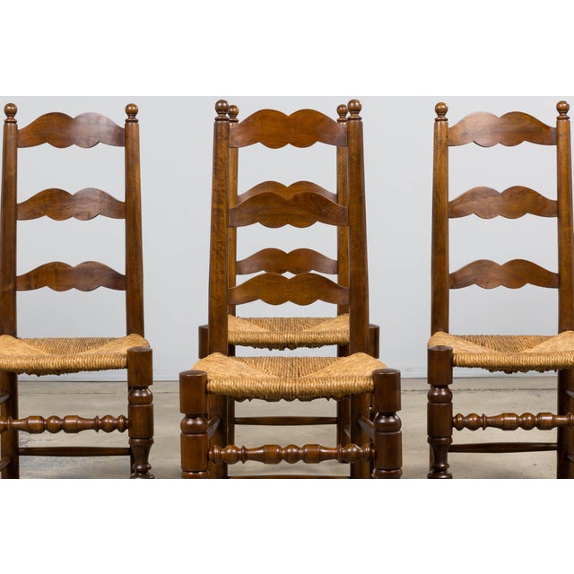 A handsome set of six late 19th century French provincial ladderback dining chairs, sourced in Provence, France. These...