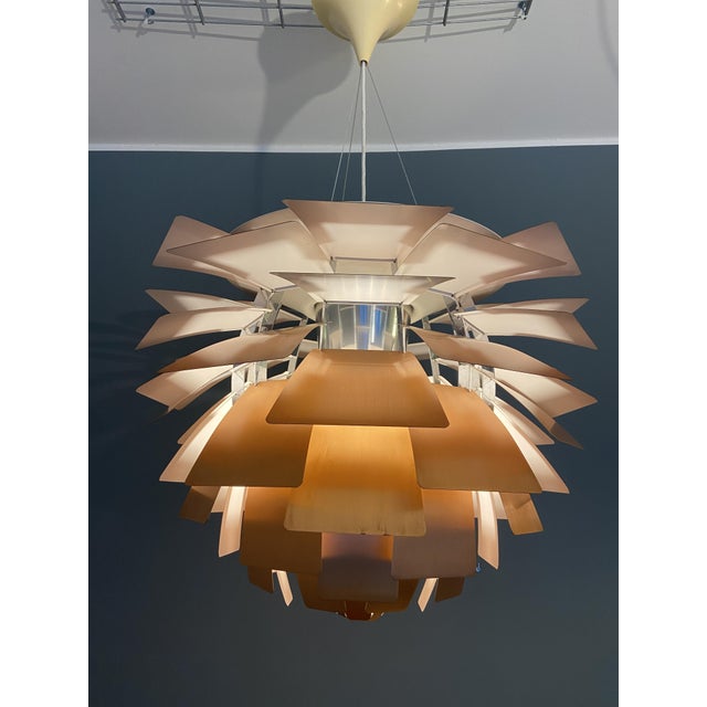 The iconic lamp by Poul Henningsen for Louis Poulsen, copper version in 72cm. This piece has an attribution mark, I am...