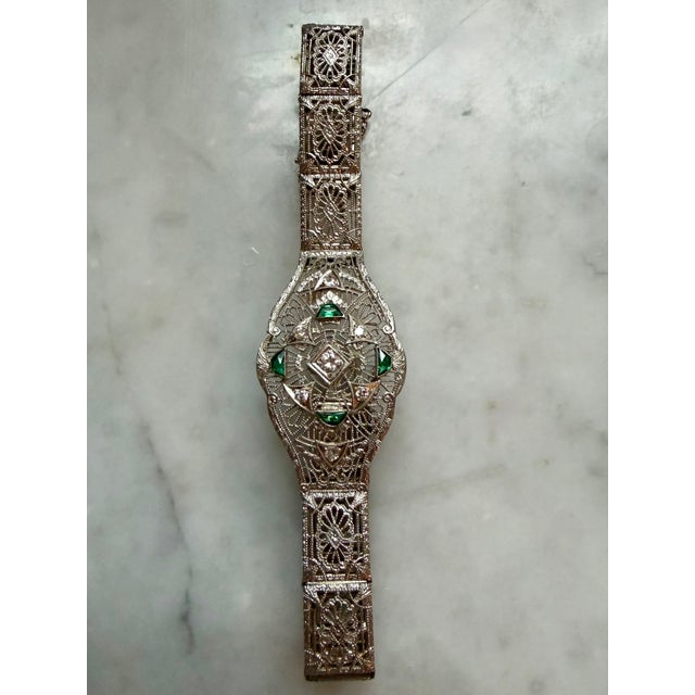 Absolutely divine Estate 1920's Platinum and 14K white gold filigree bracelet. Seven (7) Old European cut diamonds (total...