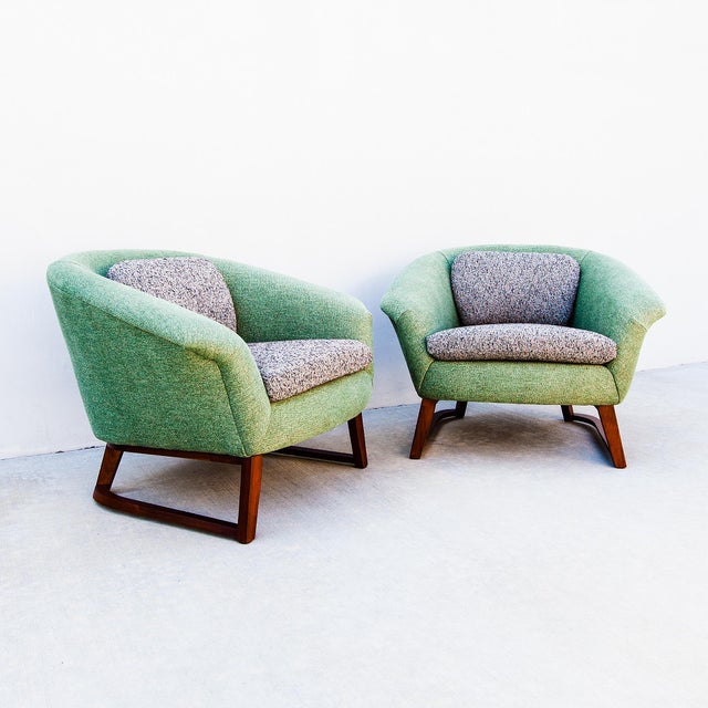 A fully restored pair of low profile barrel back lounge chairs by Jens Risom, made in the United States c. 1960s. The...