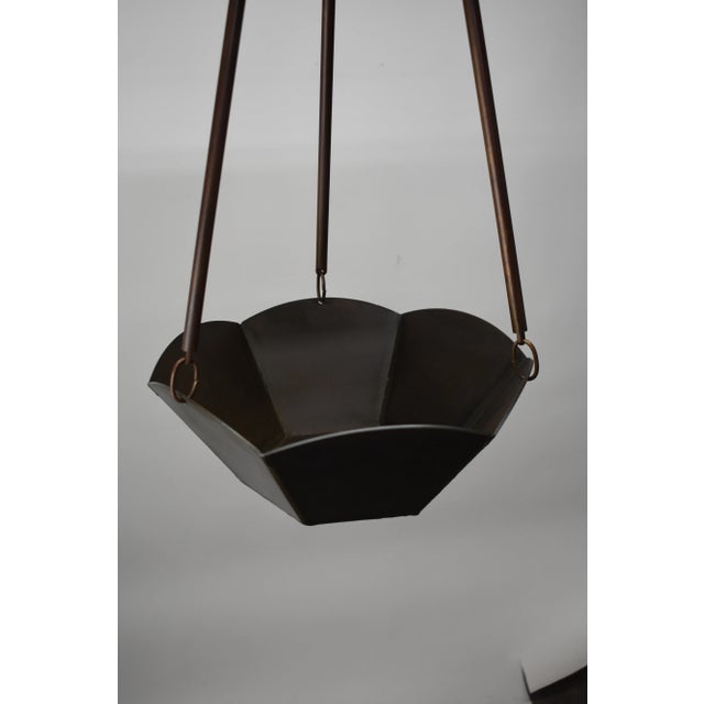 This hanging planter was designed and fabricated by Oblik studio studio of Brooklyn New York in there East Williamsburg...