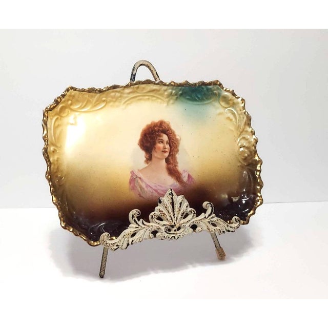 Elegant, antique tray. Made of porcelain. Portrait of a stunning young woman with auburn curls in the center -...
