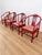 Chinese Horseshoe Back Arm chairs. Known as Quanyi Chairs. Wood is stained a deep Chinese red. Palm Pattered seat cushions...