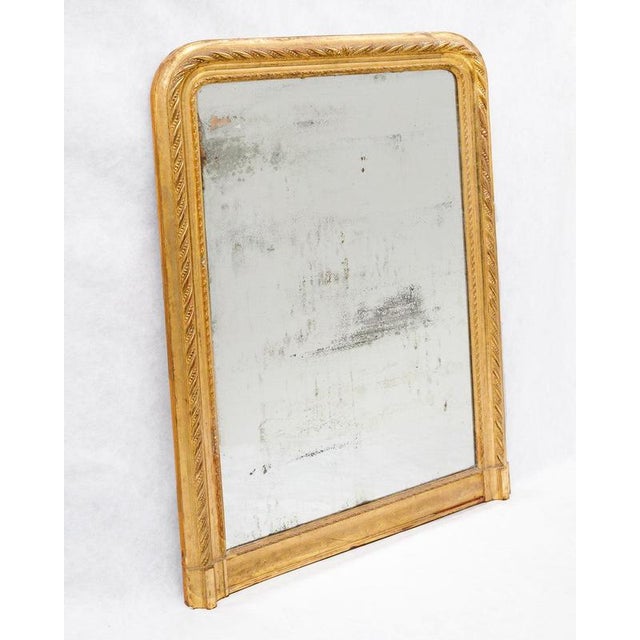 19th-Century Antique French Mirror with Distressed Mirror Plate and Faux Ribbon Frame. This beautiful antique French...