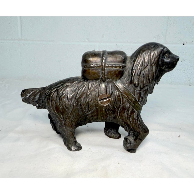 This exquisite antique early 1900's cast Iron saint bernard dog with pack still bank by A.C. Williams is a unique and...