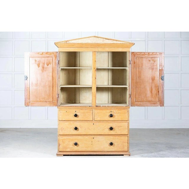 Circa 1870s. 19th c pedimented english pine linen press with a classical triangular pediment & keys. W137 x d60 x h208cm...