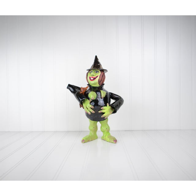 One of ten in a collection of sculptural postmodern pottery teapots, each with a feminist witch design. They come from a...