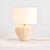 Woven in a natural cane rattan, with subtle variations in color making each one truly unique, this mini lamp is an instant...
