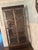 Gorgeous dark mahogany frame contrasted with stainless steel or pewter-finished circular overlays. Interior interior glass...