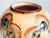 A striking ceramic vase from the 1920s, featuring finely nuanced hand-painted decoration and a softly contoured,...