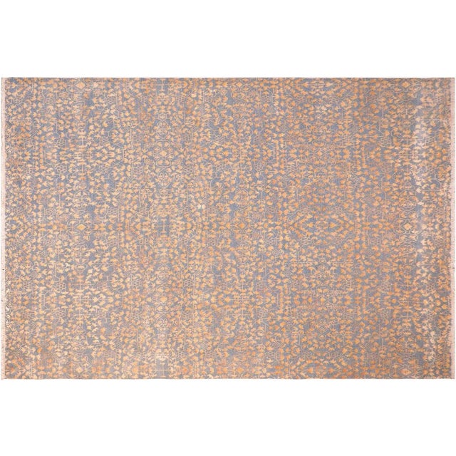 This elegant hand knotted rug features a modern fusion of beauty, with its interlocking geometric and minimalist pattern....