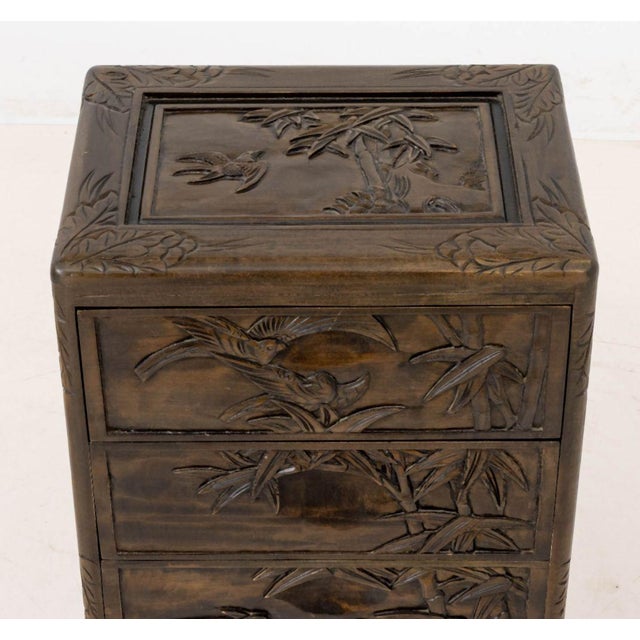 Chinese Carved Wood Bird and Bamboo Motif Chest of Drawers, with five drawers above ball and claw feet. 31" H x 15.75" W x...